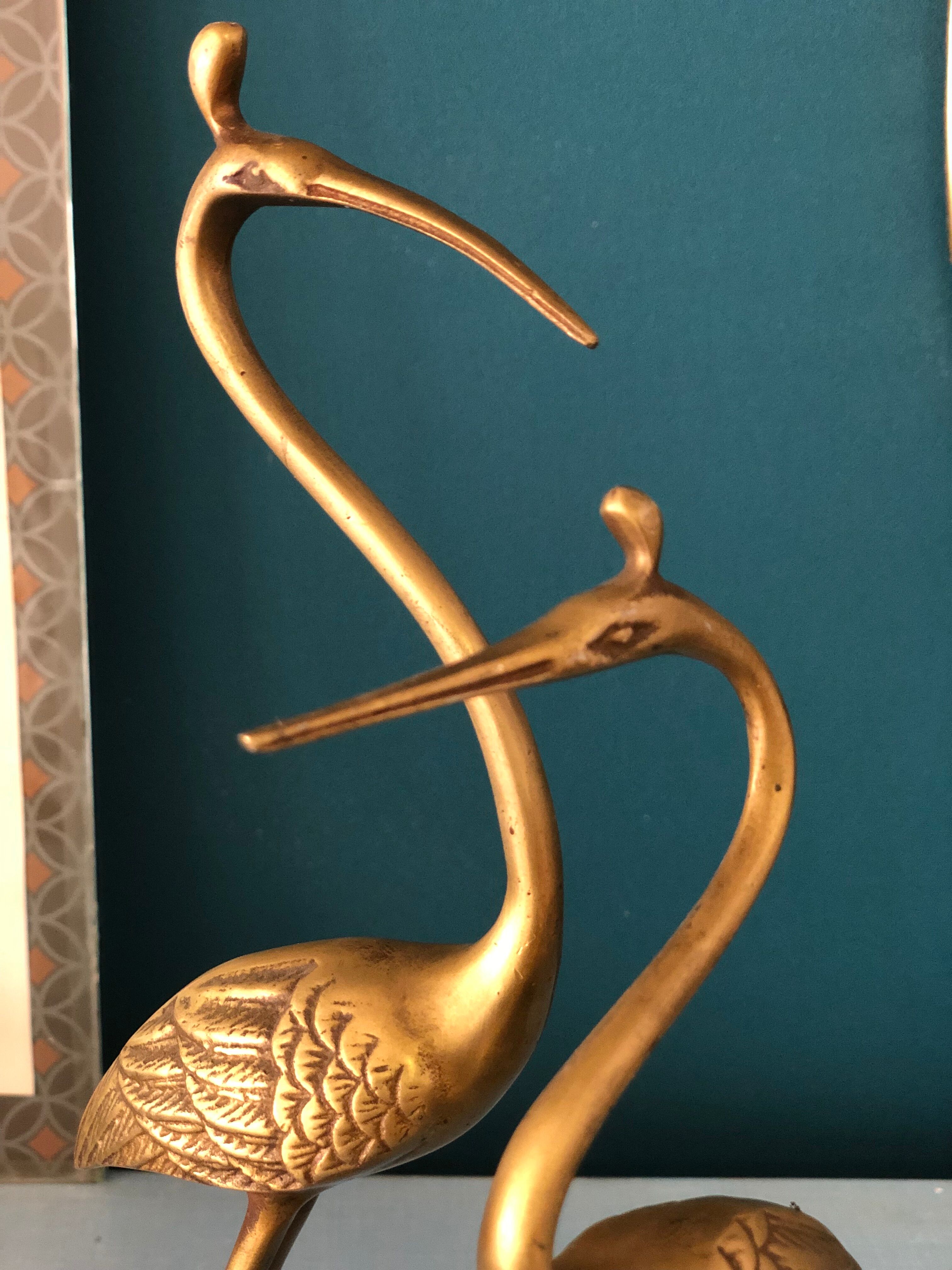 Couple of brass herons