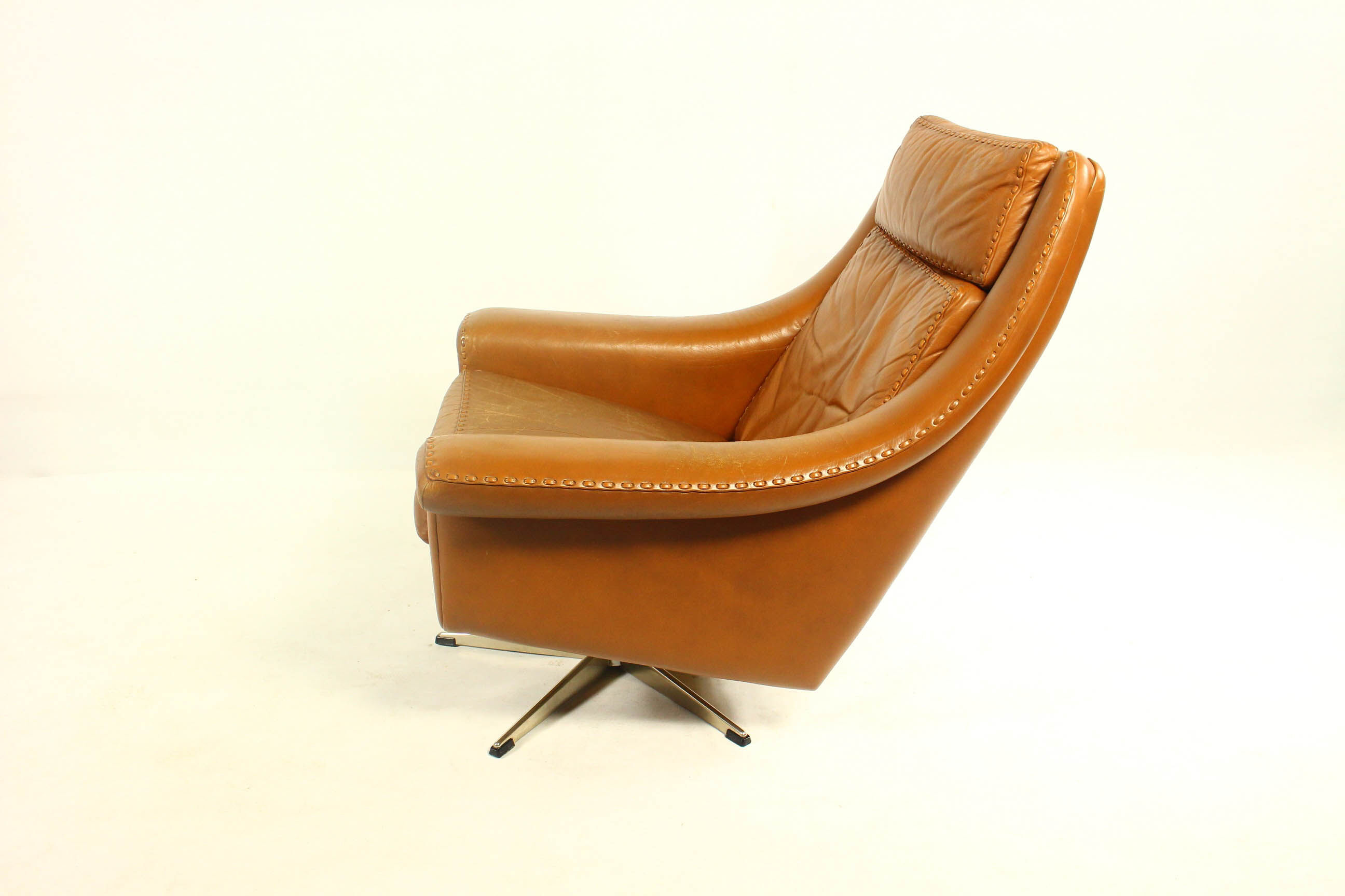 Matador swivel leather chair with ottoman by Aage Christiansen for Erhardsen & Andersen, 1960s