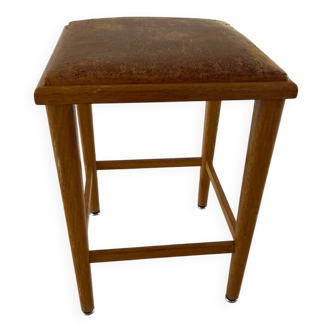 Vintage stool from the 60s with aged leather seat