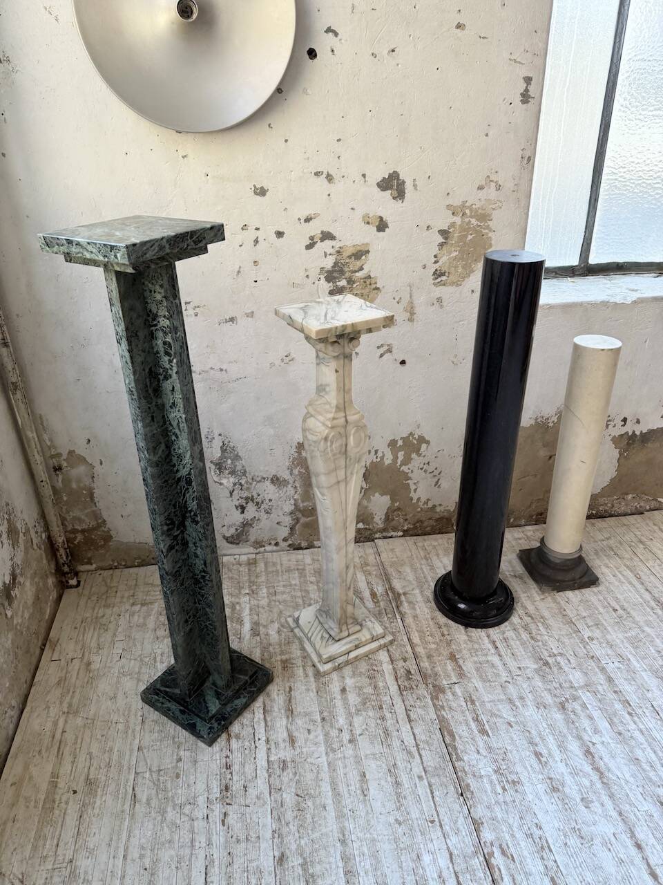 Set of 4 marble columns or pedestals.