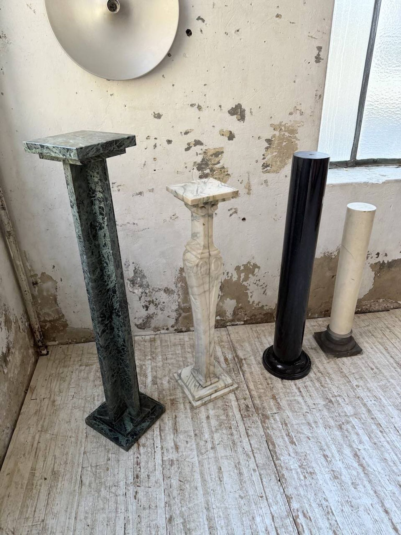Set of 4 marble columns or pedestals.