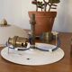 Pair of antique half-spherical ceiling sconces in white glass and brass.