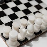 Vintage black-and-white marble chessboard with matching marble pieces, Italian 1960s design, sculptural centerpiece