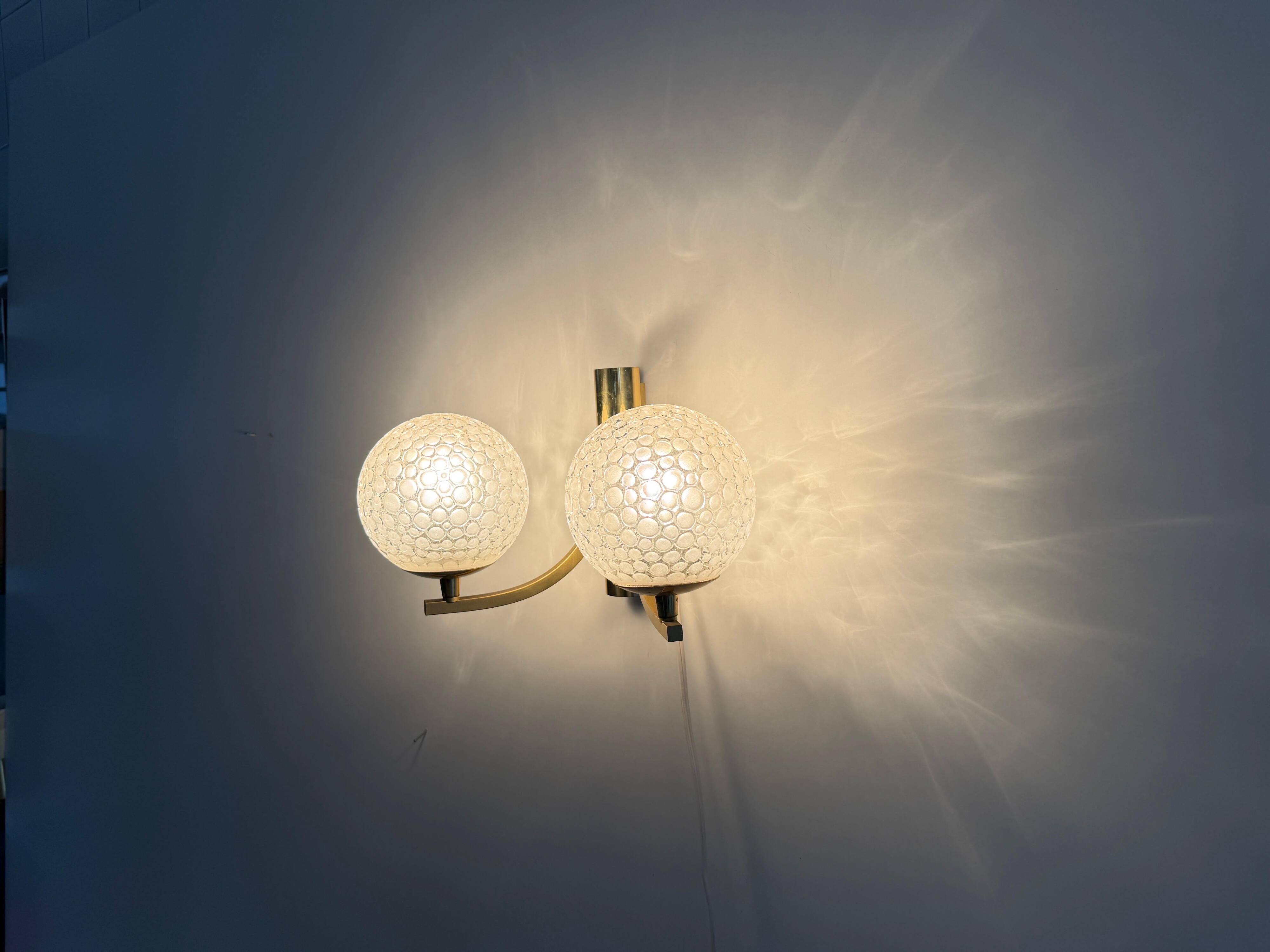 Simple two-armed wall light in brass and glass by Ball and Ball, Kaiser, 1960s, Germany.
