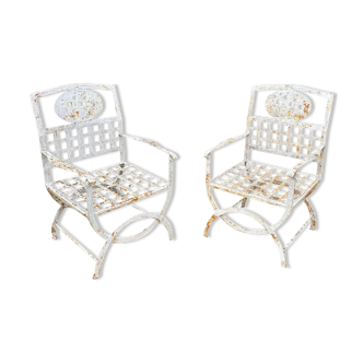 Pair of wrought iron armchairs