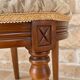 Antique Louis XVI style chair in wood and floral fabric.