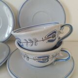 Glazed earthenware cups and saucers