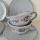 Glazed earthenware cups and saucers