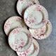 6 pink ironstone deep plates from Gien, "Roses de Noël" service.
