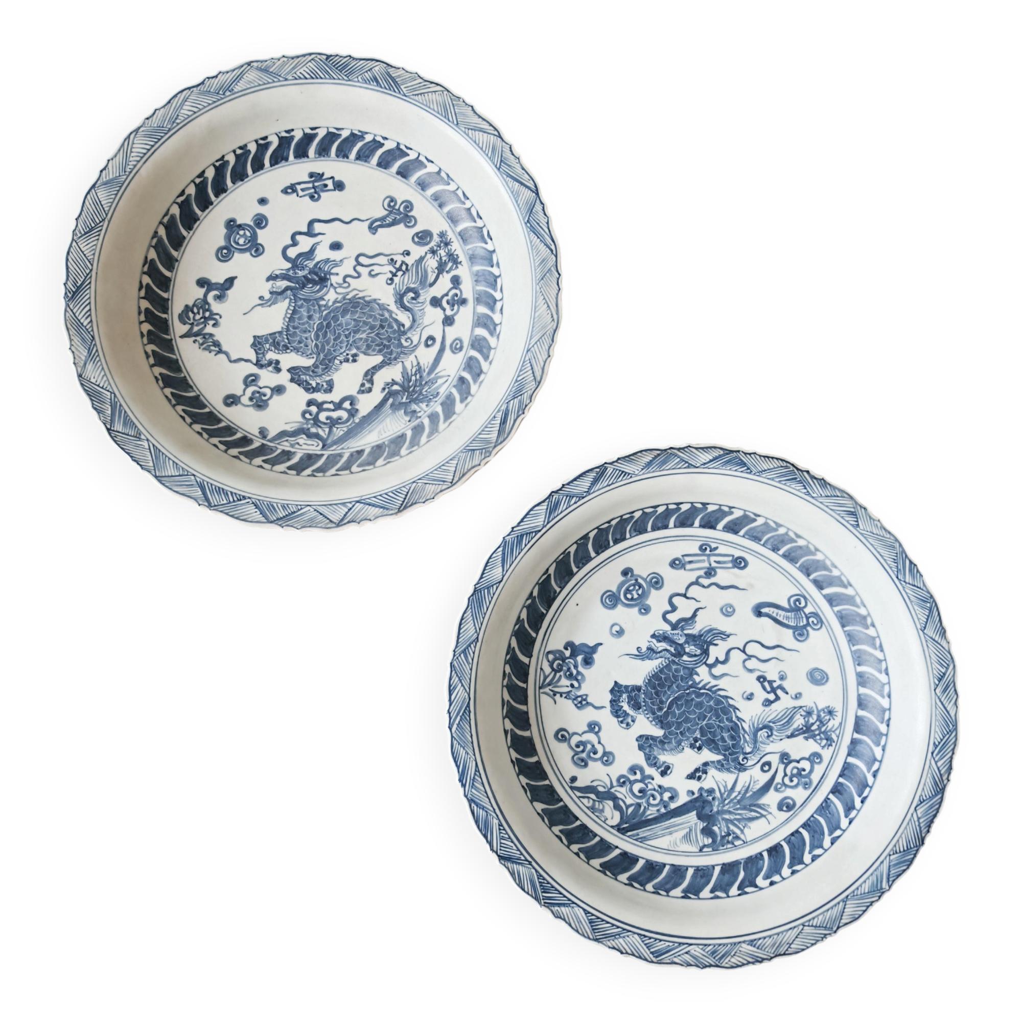 Pair of antique Chinese decorative plates with dragon motif.