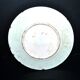 Antique plate in turquoise brown green slip with arabesque decoration
