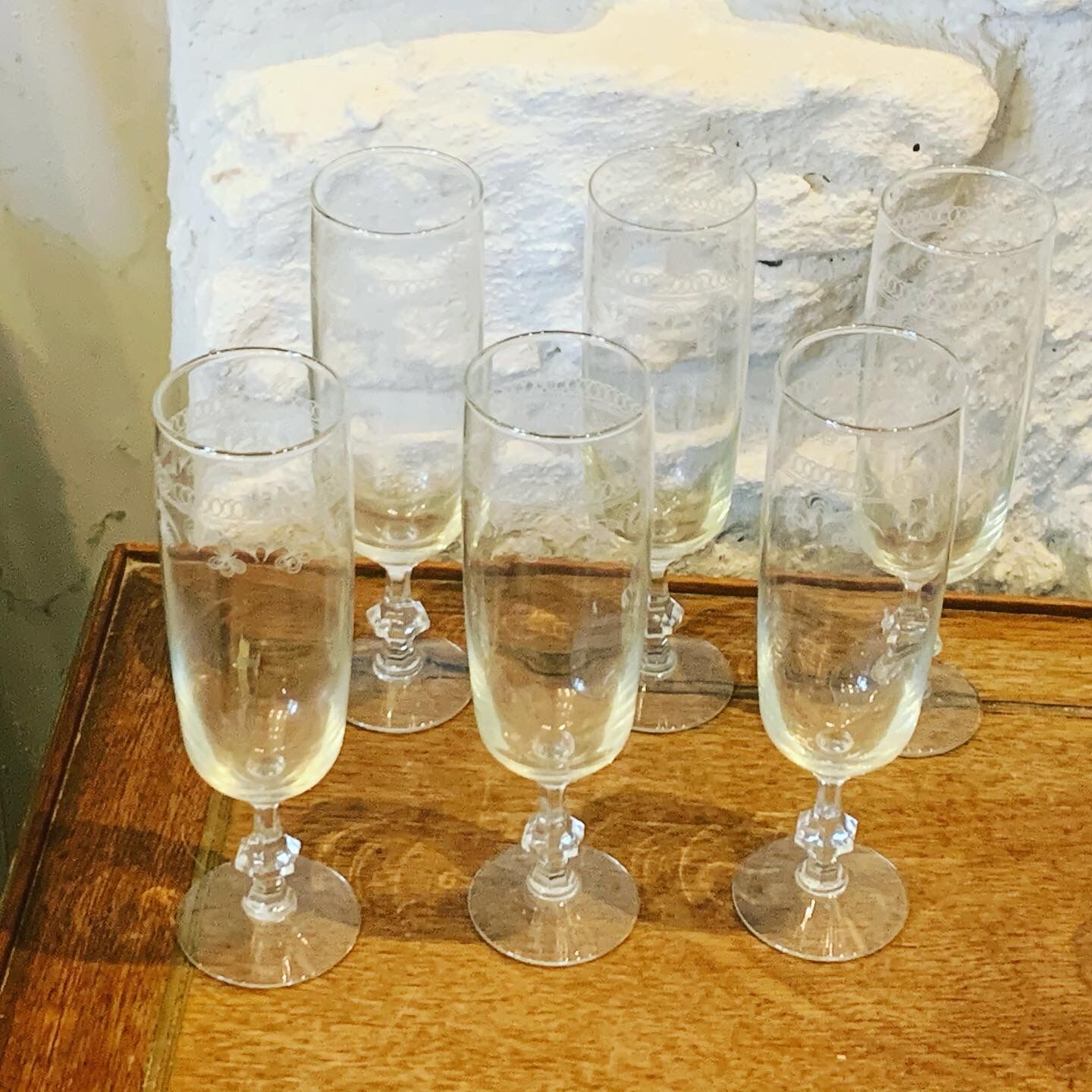 6 chiseled champagne flutes on vintage floral frieze pattern