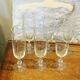 6 chiseled champagne flutes on vintage floral frieze pattern
