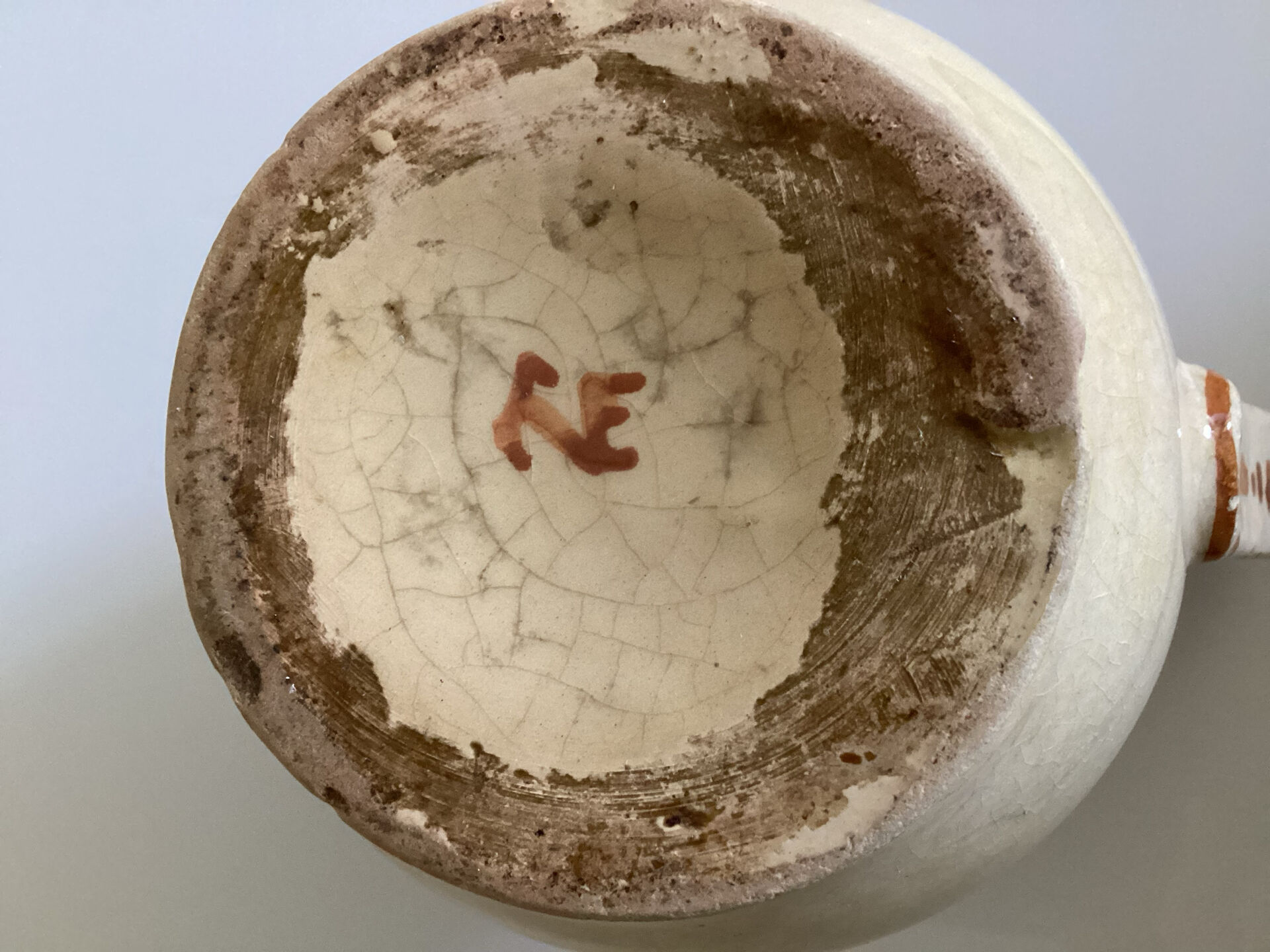 Old ceramic jug with floral decoration