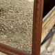 Large wall mirror with an elegant wooden frame.