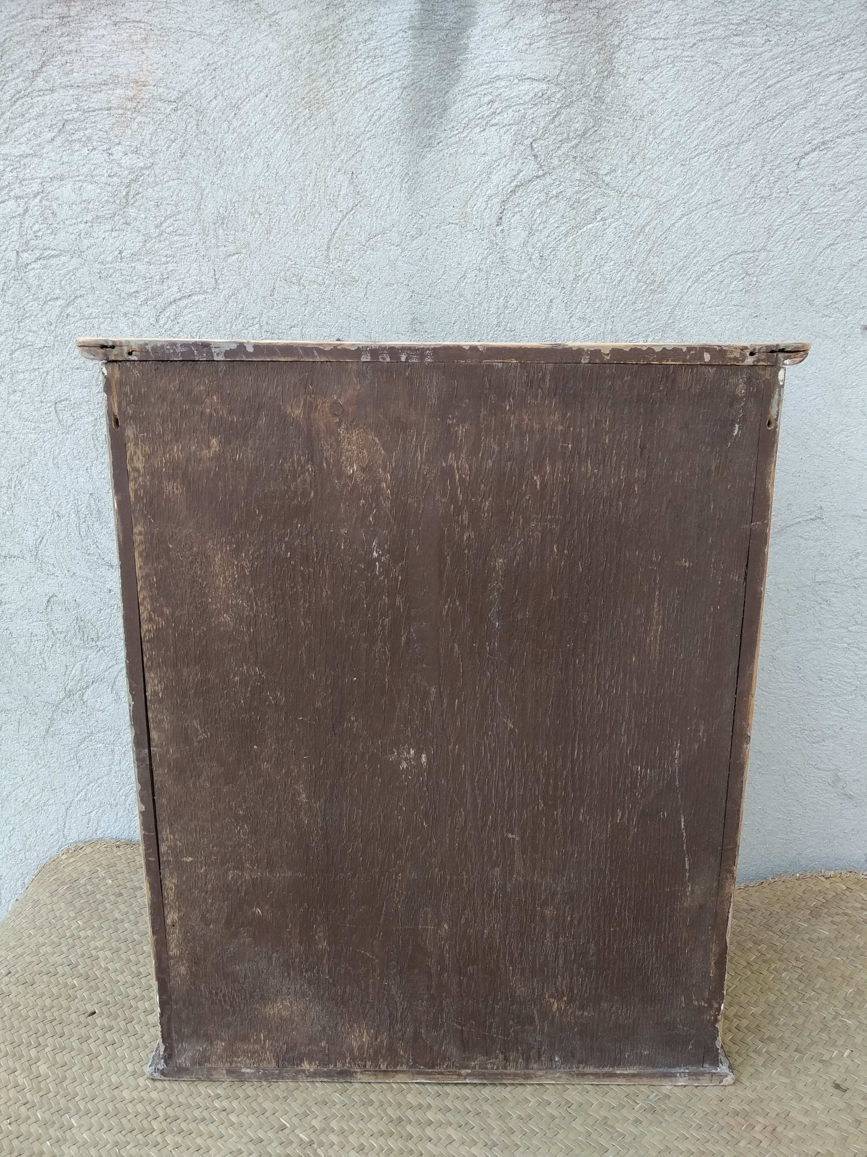 Antique wooden bathroom cabinet patinated
