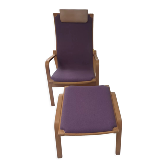 Relaxing armchair and its Scandinavian footrest