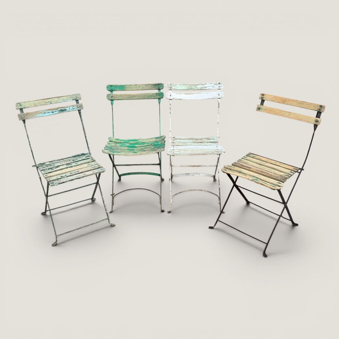 Bistro tables and folding chairs with a patina from the original 1930s.