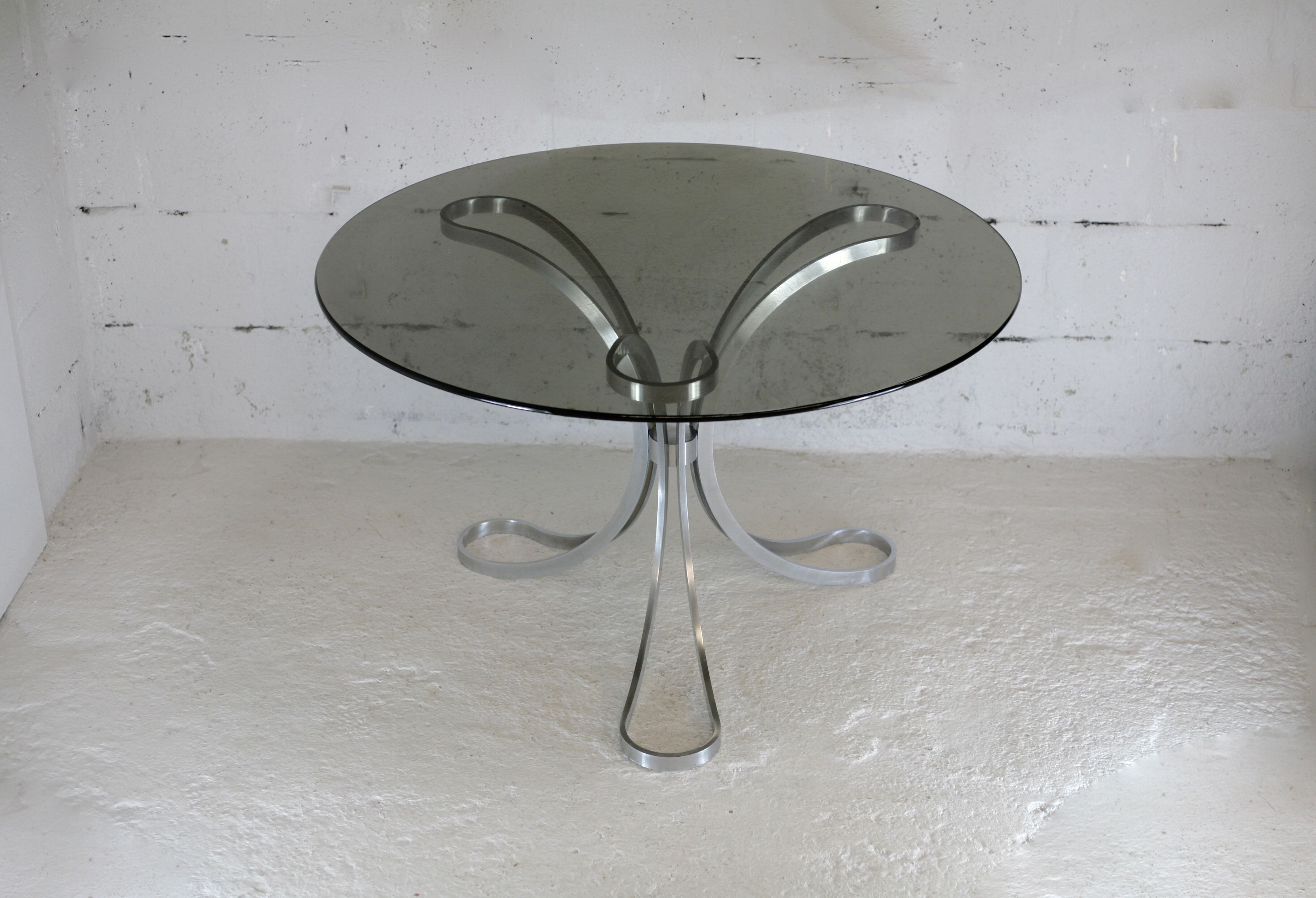 Living room table "Space Age" polished steel, circular slab smoked glass. France, circa 1970.