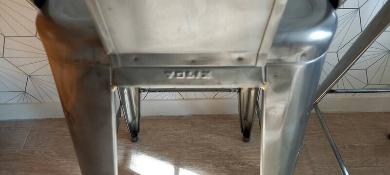 Pair of tolix hpd 75 stools – in varnished raw steel.