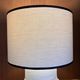 Table lamp in ceramic with a handmade couture-style lampshade from France.