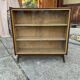 Mid-century brown wooden library (beech & pine) with glass doors from the 1960s.