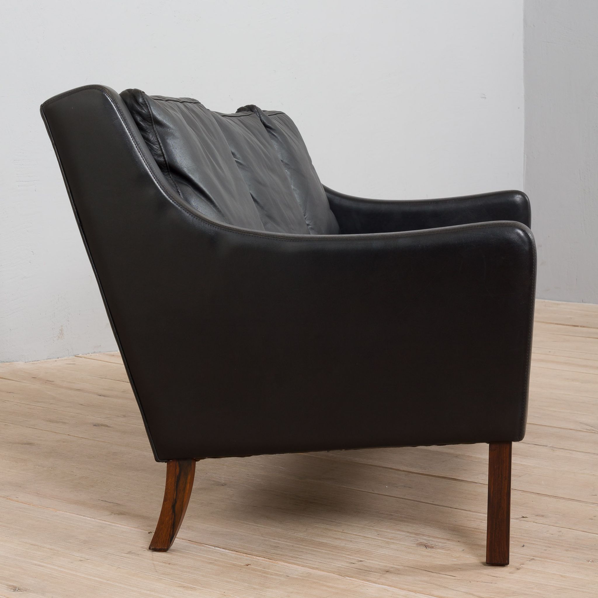 Danish black leather and rosewood sofa