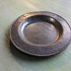 Assiette en étain marquée JF 1670