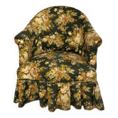 Green and yellow floral fabric armchair.