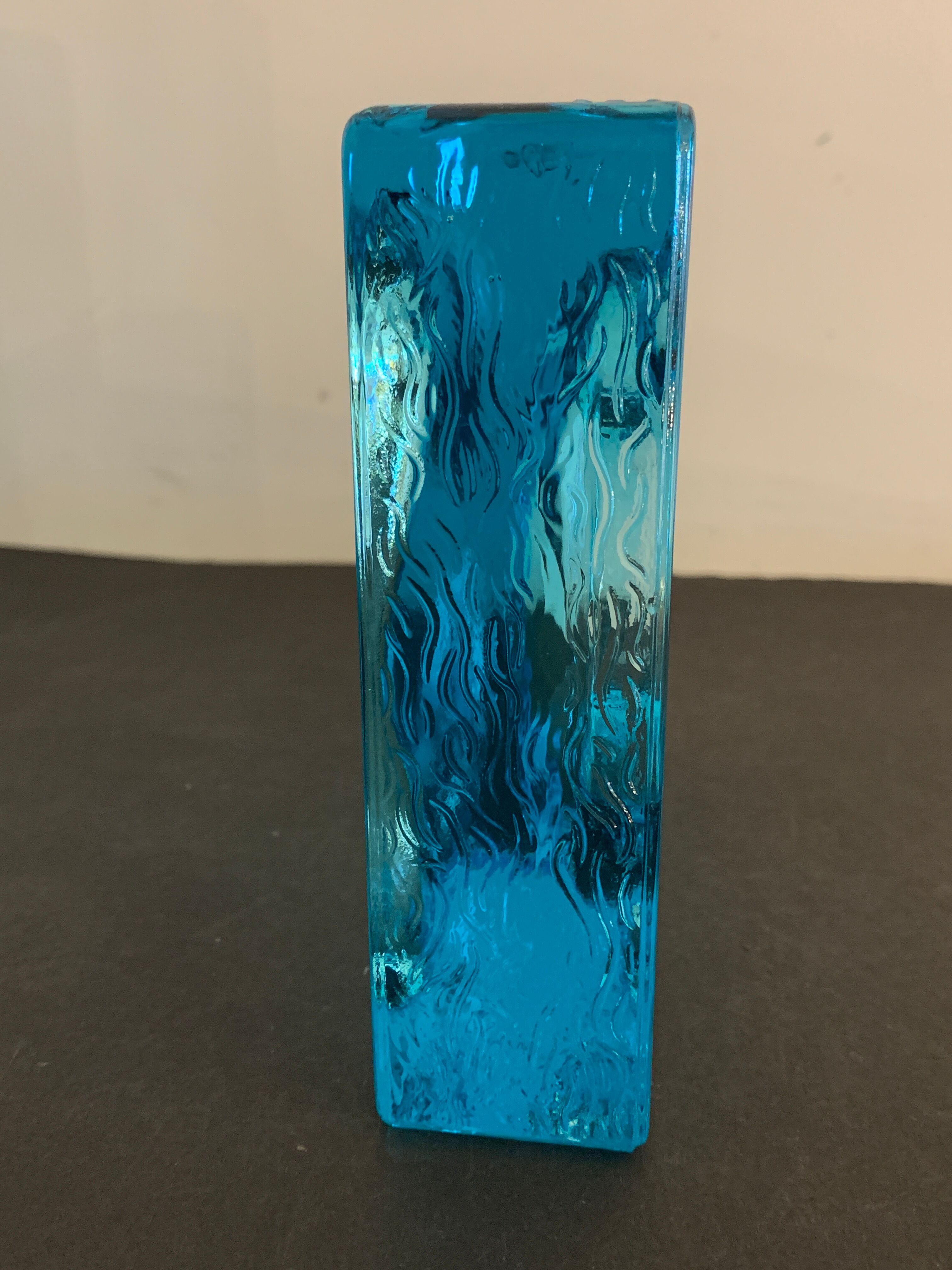 Ashtray paved in blue glass