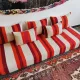 Set of covers for cream and red Moroccan floor sofa.