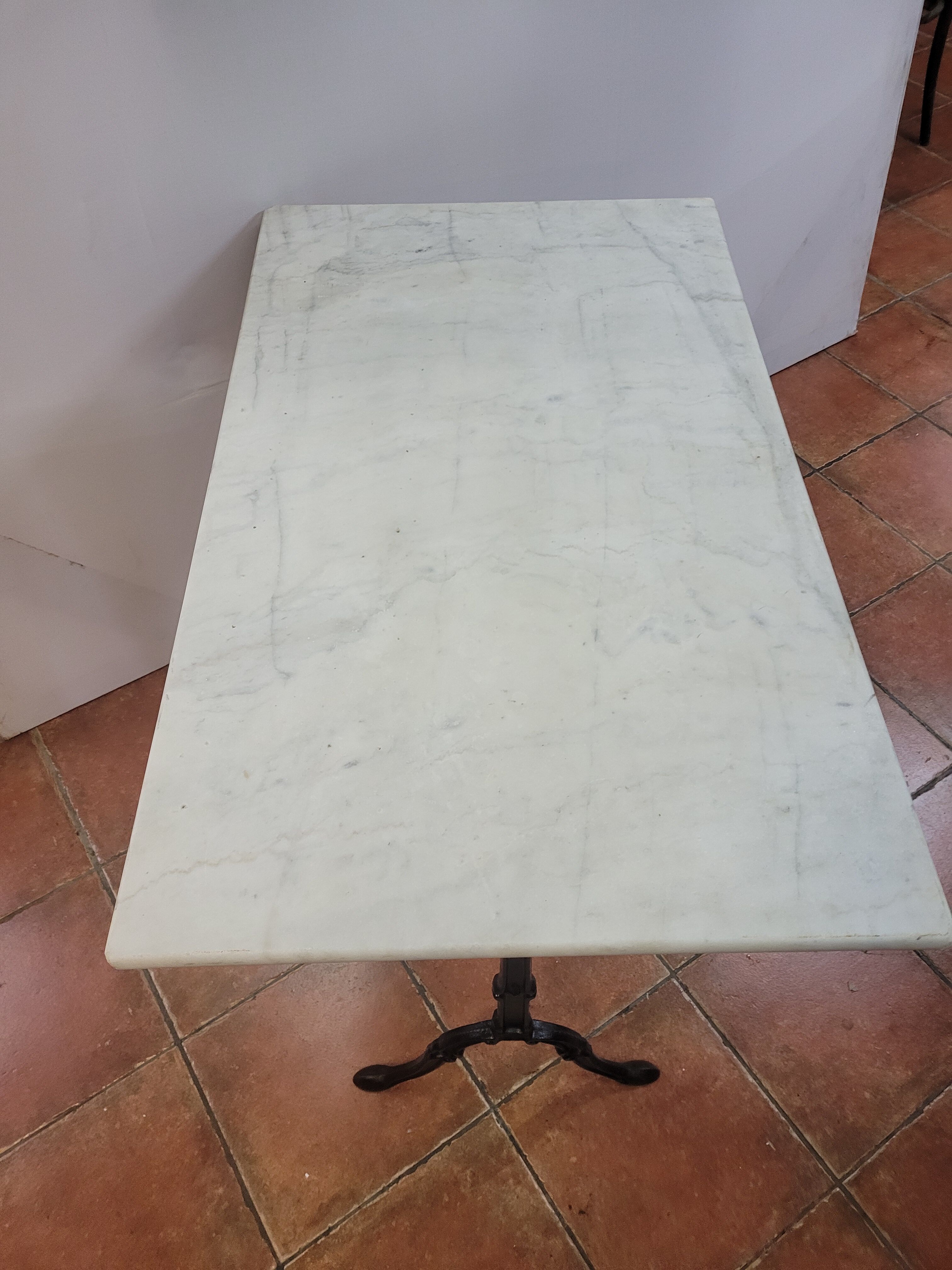Bistro table base cast iron over marble