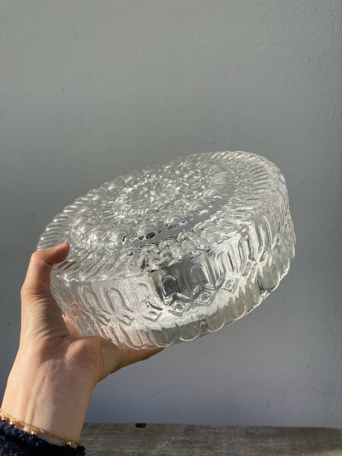 Pair of transparent round glass wall lights