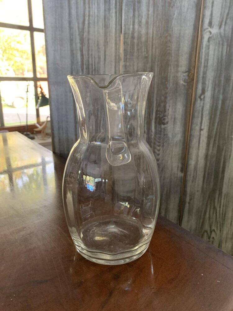 Transparent glass pitcher Mid-Century (1960s) — Czech Republic, bulbous silhouette and integrated handle.