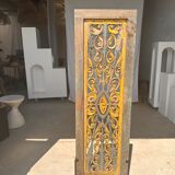 Rectangular Indonesian construction element with blue and yellow plant in carved wood