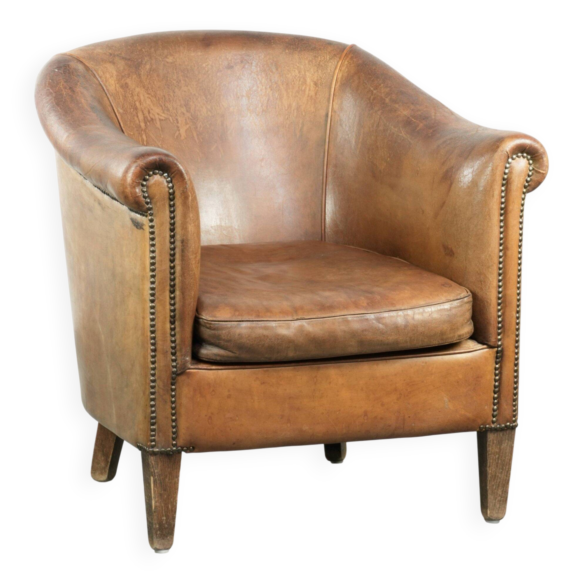 Vintage sheepskin club armchair finished with decorative nails