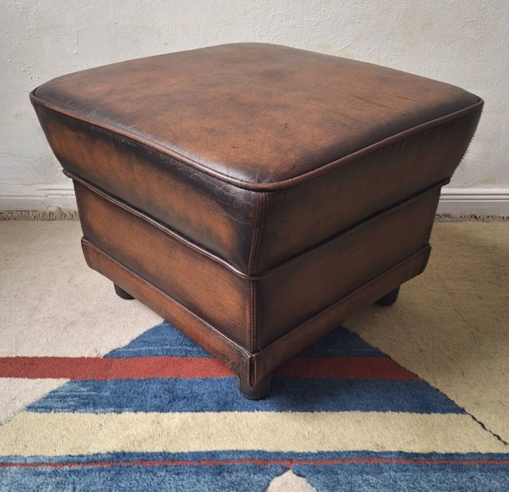 Vintage ottoman / pouffe in chestnut brown leather