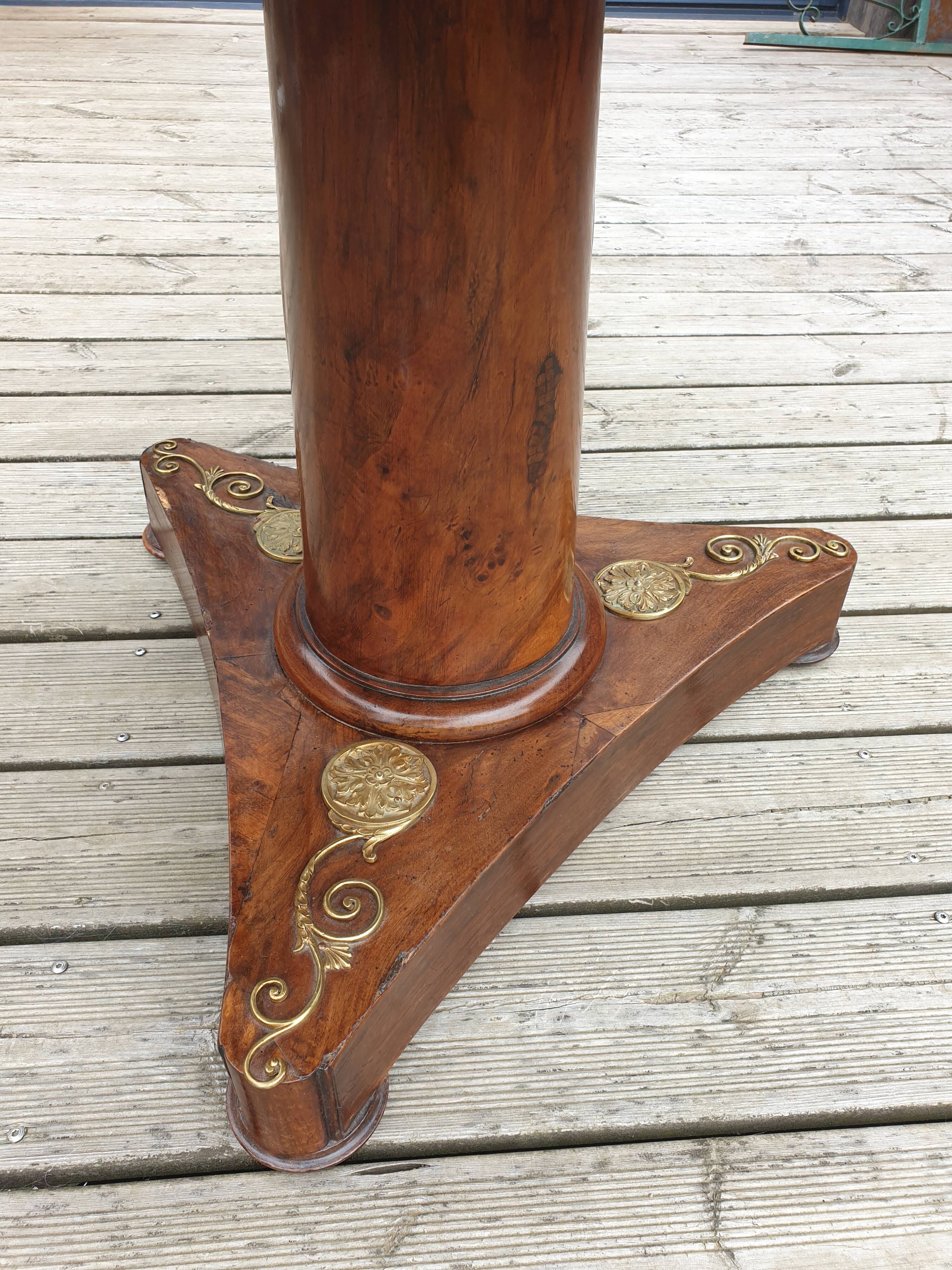 Pedestal table above marble