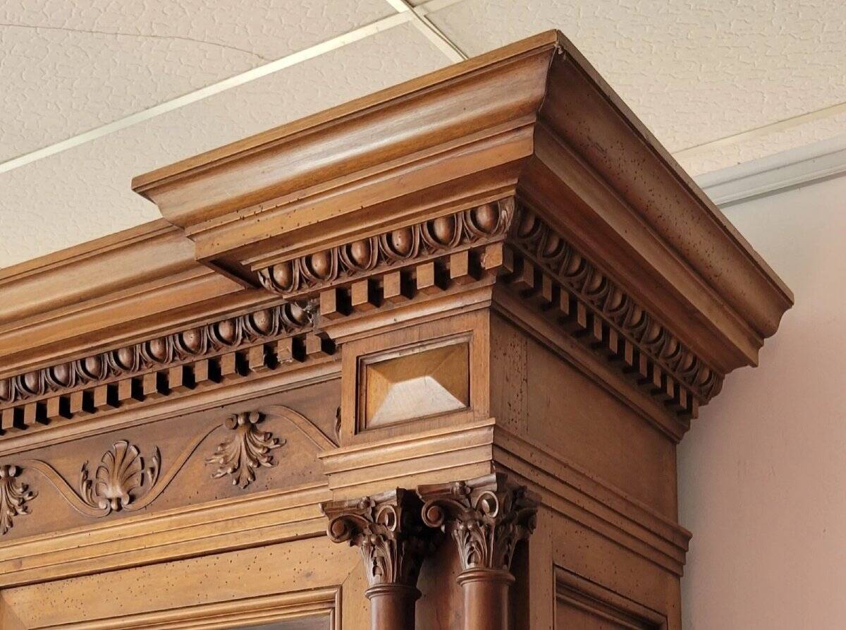 Two-body buffet, made of richly carved solid walnut.