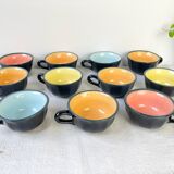 Vintage black earthenware coffee cups with multi-colored background, 1970s