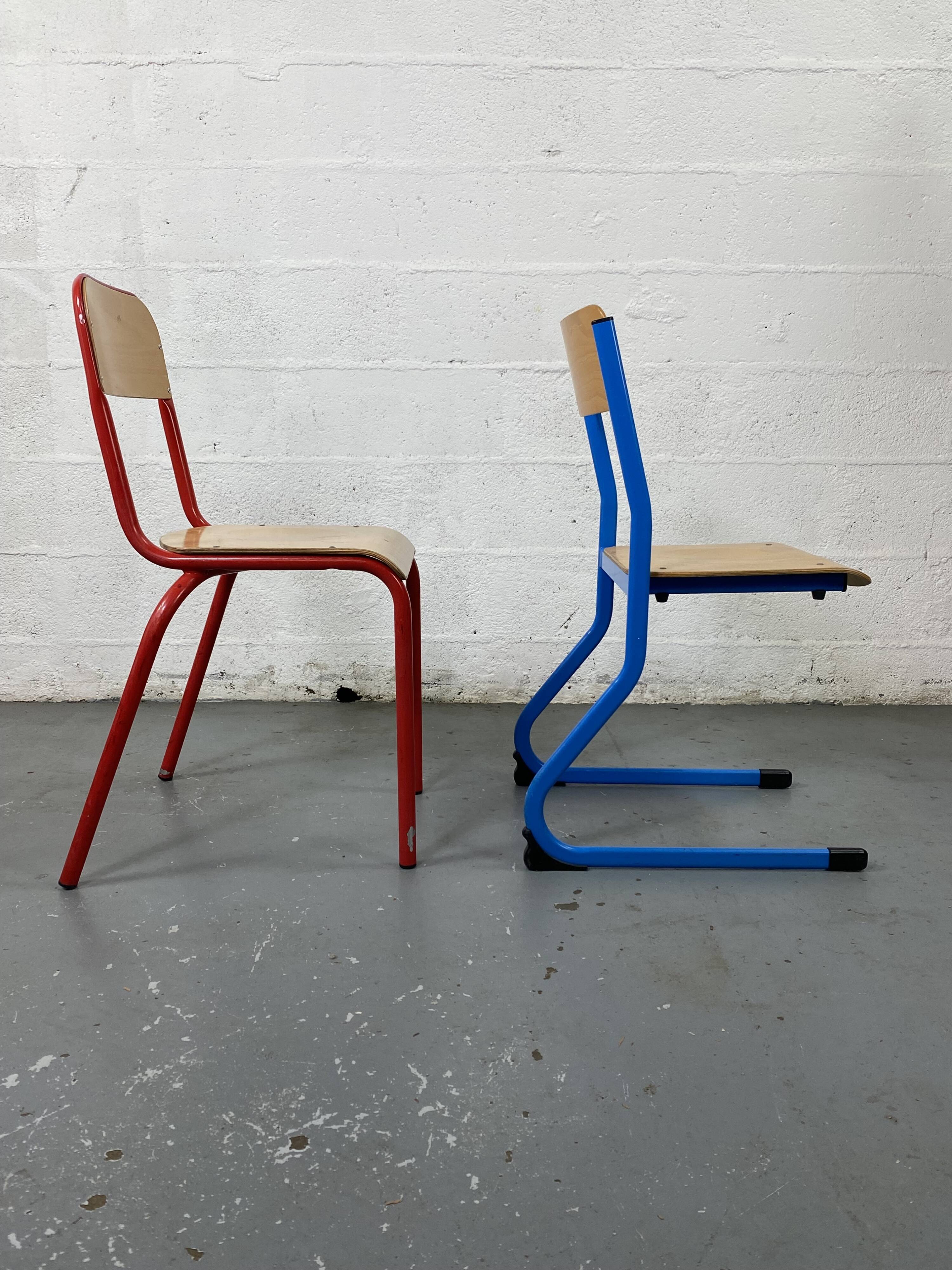 Set of 2 mismatched industrial school chairs
