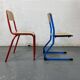 Set of 2 mismatched industrial school chairs