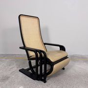 Rocking lounge chair, curved wood, leather, Viennese cane design.