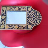 Mirror with black and gold screen-printed glass surround