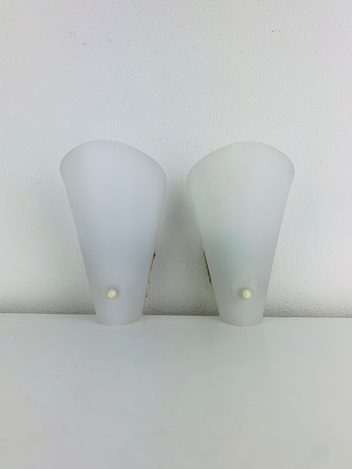Pair of 1950s striped plastic wall lights.