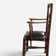 Antique rustic armchair in walnut and leather, 18th century.