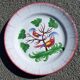 Earthenware plate with parrot decoration