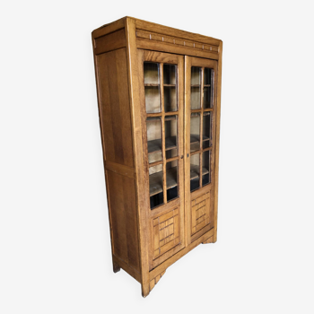 Vintage oak bookcase from the reconstruction period with 2 doors with small panes.
