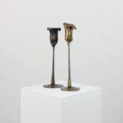 Pair of vintage brass candle holders with tulip decoration.