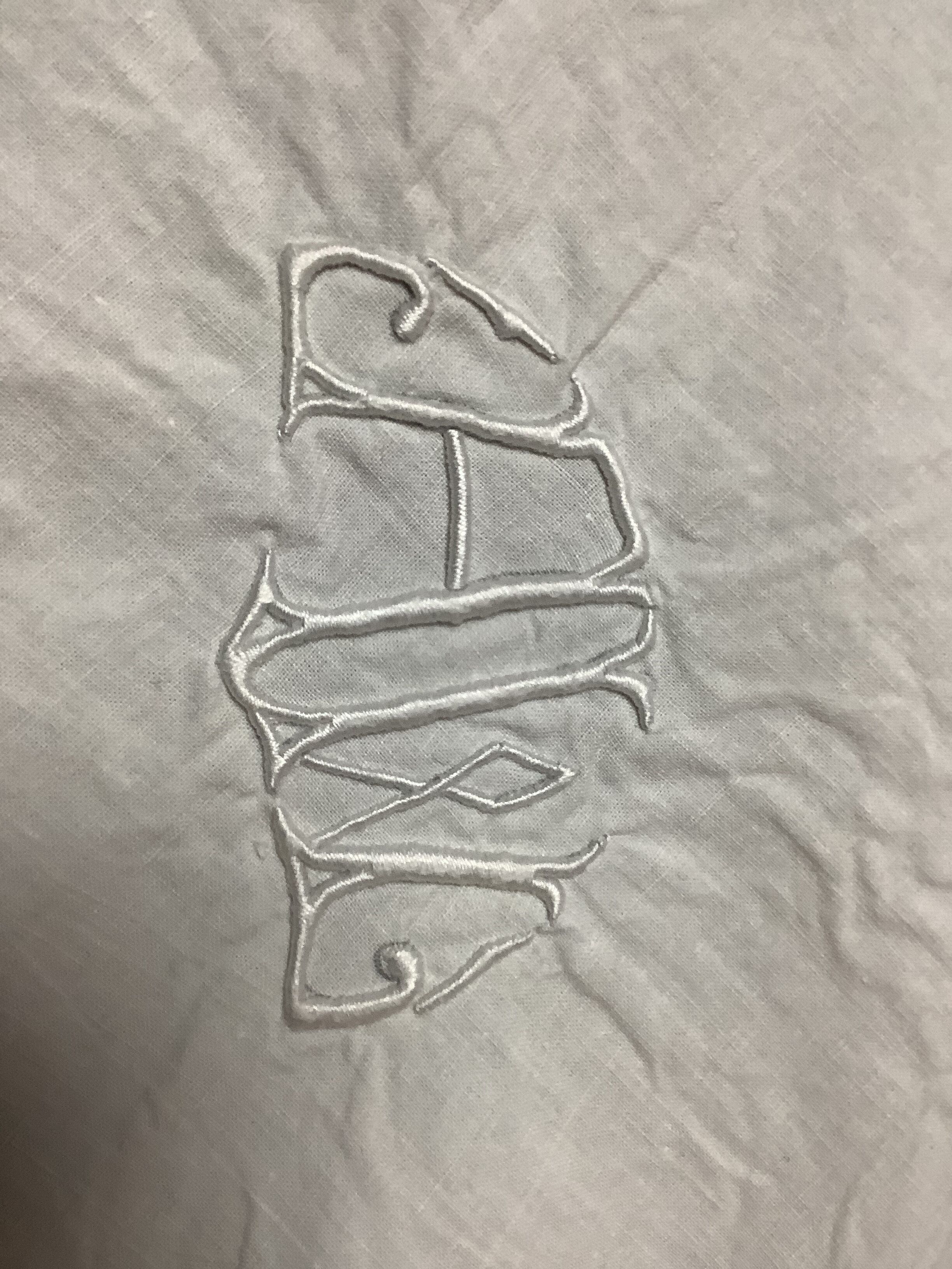 Embroidered table placemat with initials AW